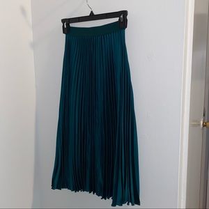 green pleated midi skirt